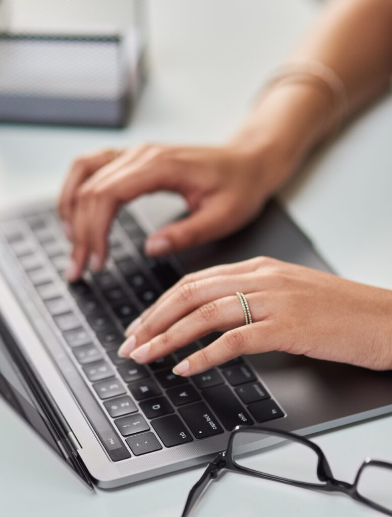 typinghandsandlaptopforadministrationbusinessorcommunicationin